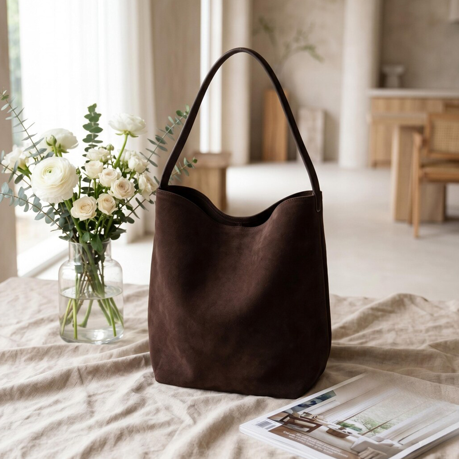 Dark Brown Matte Suede Slouchy Vertical Bucket Shoulder Tote With Single Slim Integrated Shoulder Strap And Interior Drawstring Rim Tab Detail