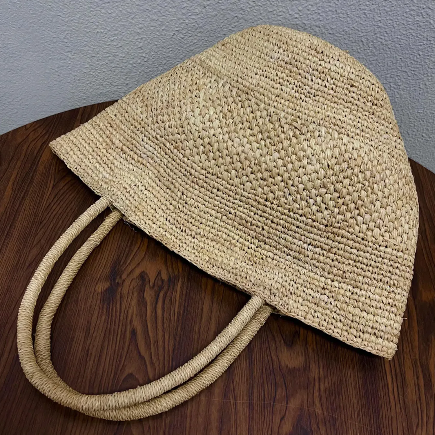 Natural Beige Hand Woven Raffia Wide Open-Top Tote With Double Looped Integrated Shoulder Handles And Collapsible Lightweight Organic Fiber Silhouette