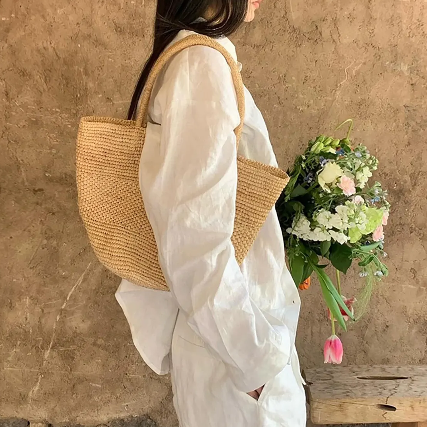 Natural Beige Hand Woven Raffia Wide Open-Top Tote With Double Looped Integrated Shoulder Handles And Collapsible Lightweight Organic Fiber Silhouette