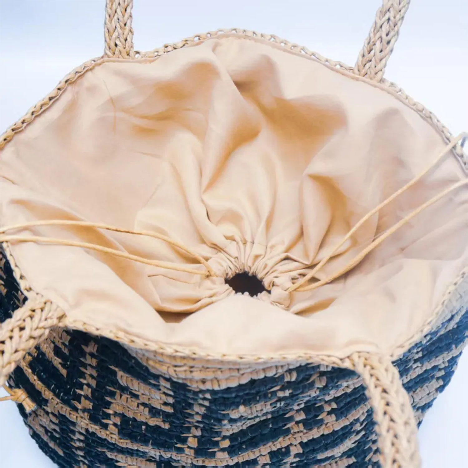 Handwoven Raffia Bucket Tote With Braided Dual Top Handles, Interior Drawstring Cinch Closure And Full Smooth Fabric Lining