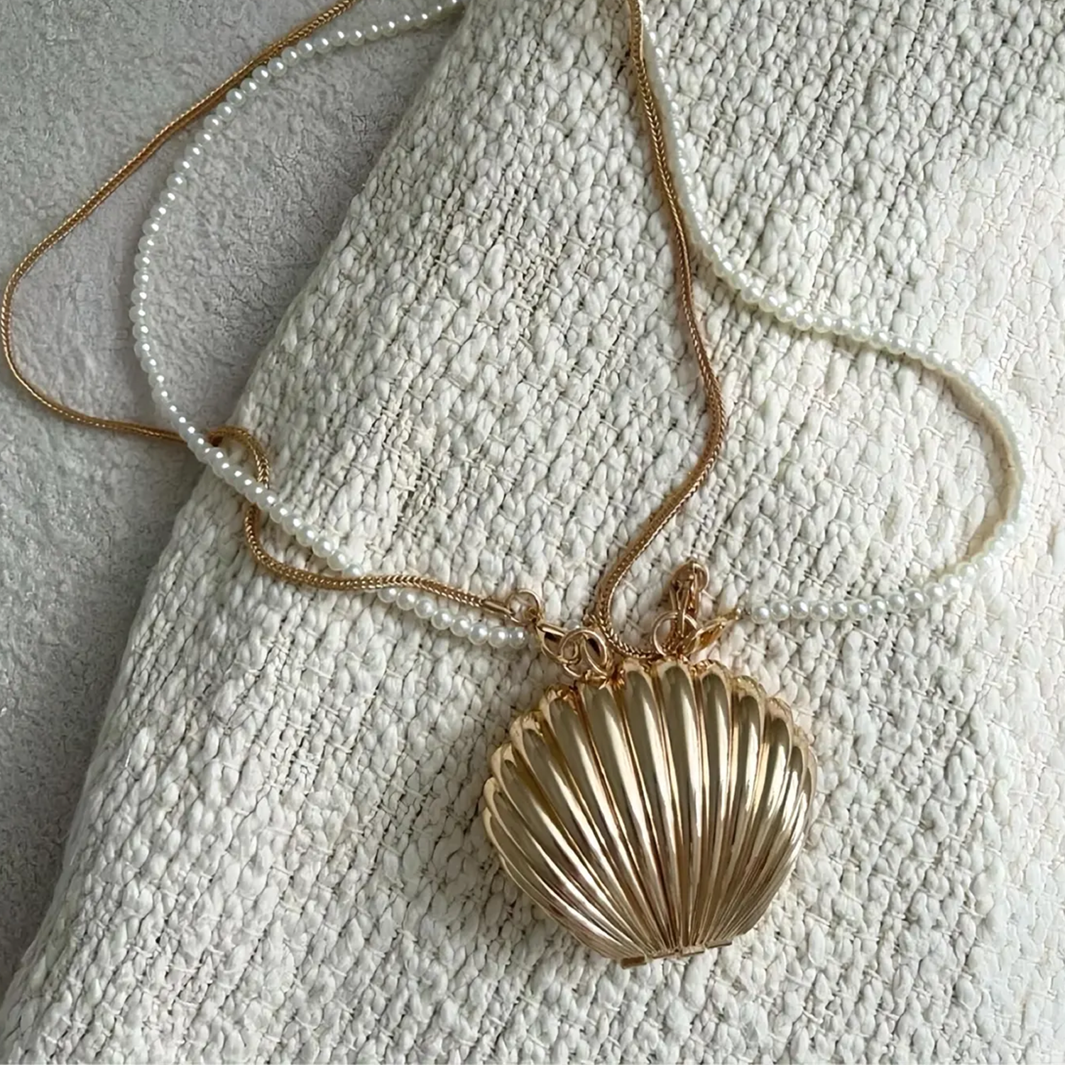 Dual Tone Polished Ribbed Metal Seashell Mini Clutch With Pearl Bead Strand, Slim Metallic Snake Chain And Hidden Magnetic Hinge Closure Wristlet
