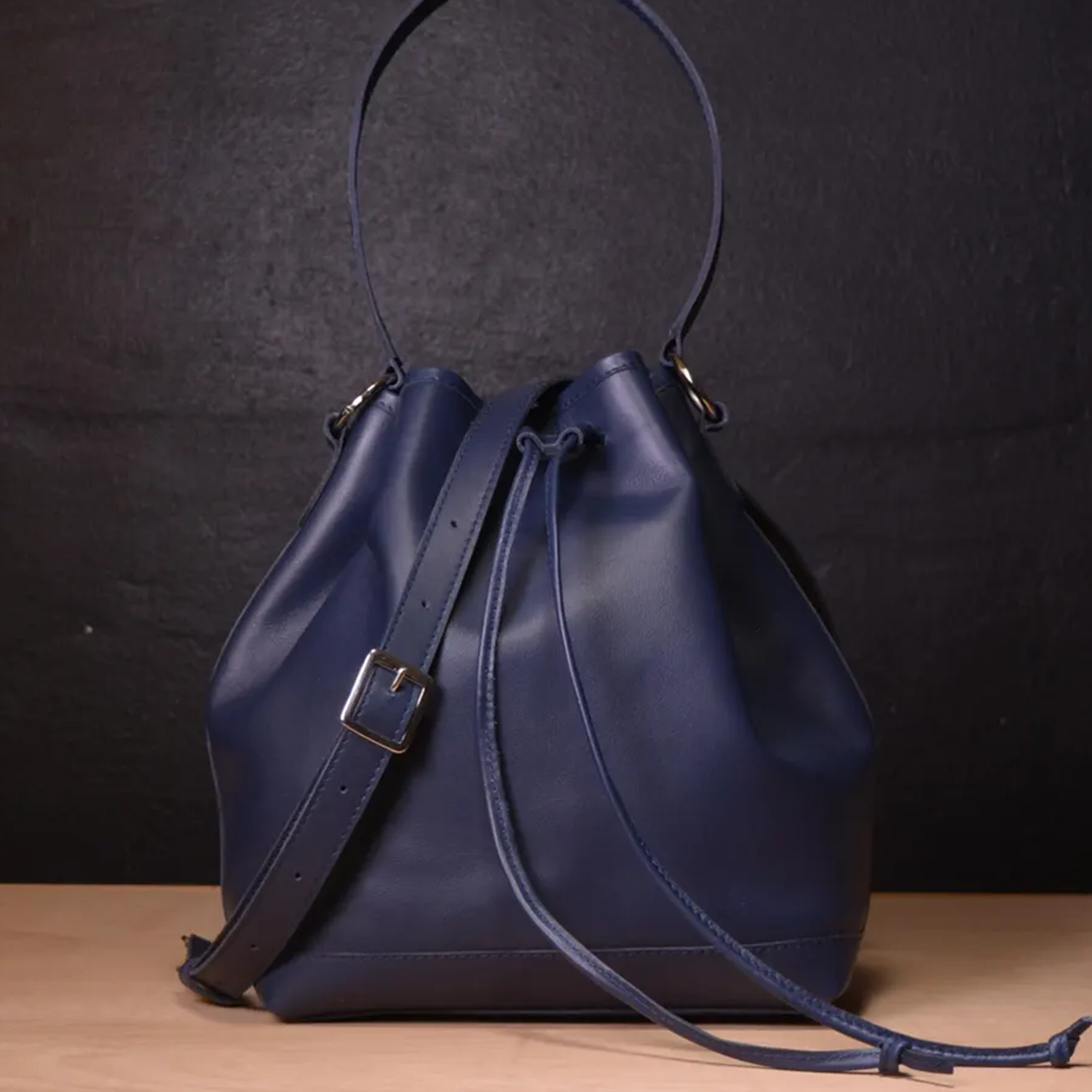 Rich Navy Smooth Matte Leather Slouchy Bucket Carry With Drawstring Cinch Rim, Fixed Short Top Loop And Buckle Adjustable Shoulder Strap Hardware