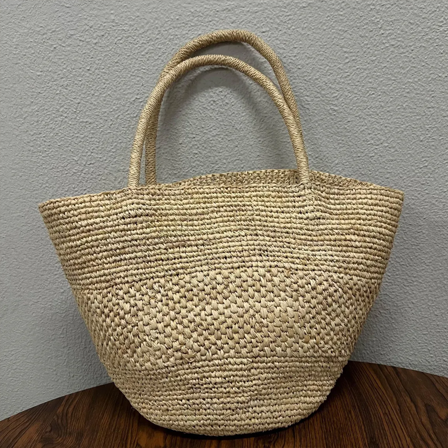 Natural Beige Hand Woven Raffia Wide Open-Top Tote With Double Looped Integrated Shoulder Handles And Collapsible Lightweight Organic Fiber Silhouette